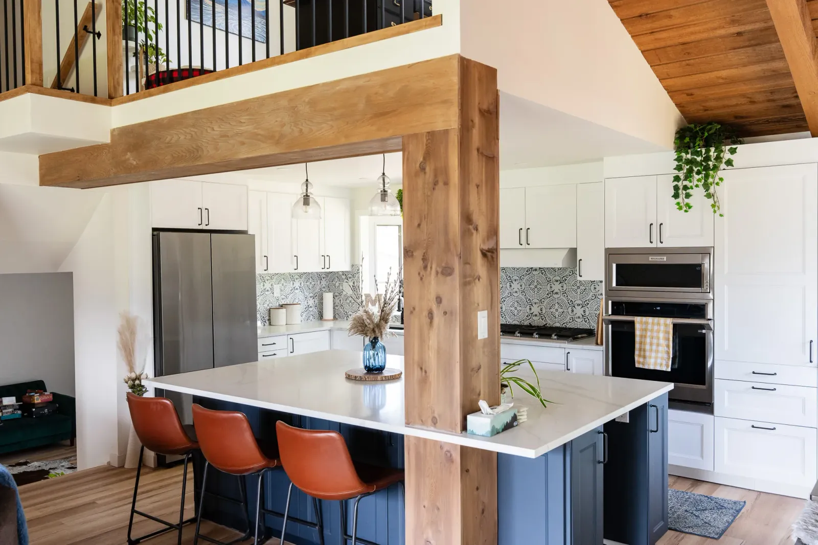 Wide shote of the custom solid wood beam and post in a stunning kitchen Wide shot of the custom solid wood beam and post in a stunning kitchen renovation in Calgary in Calgary