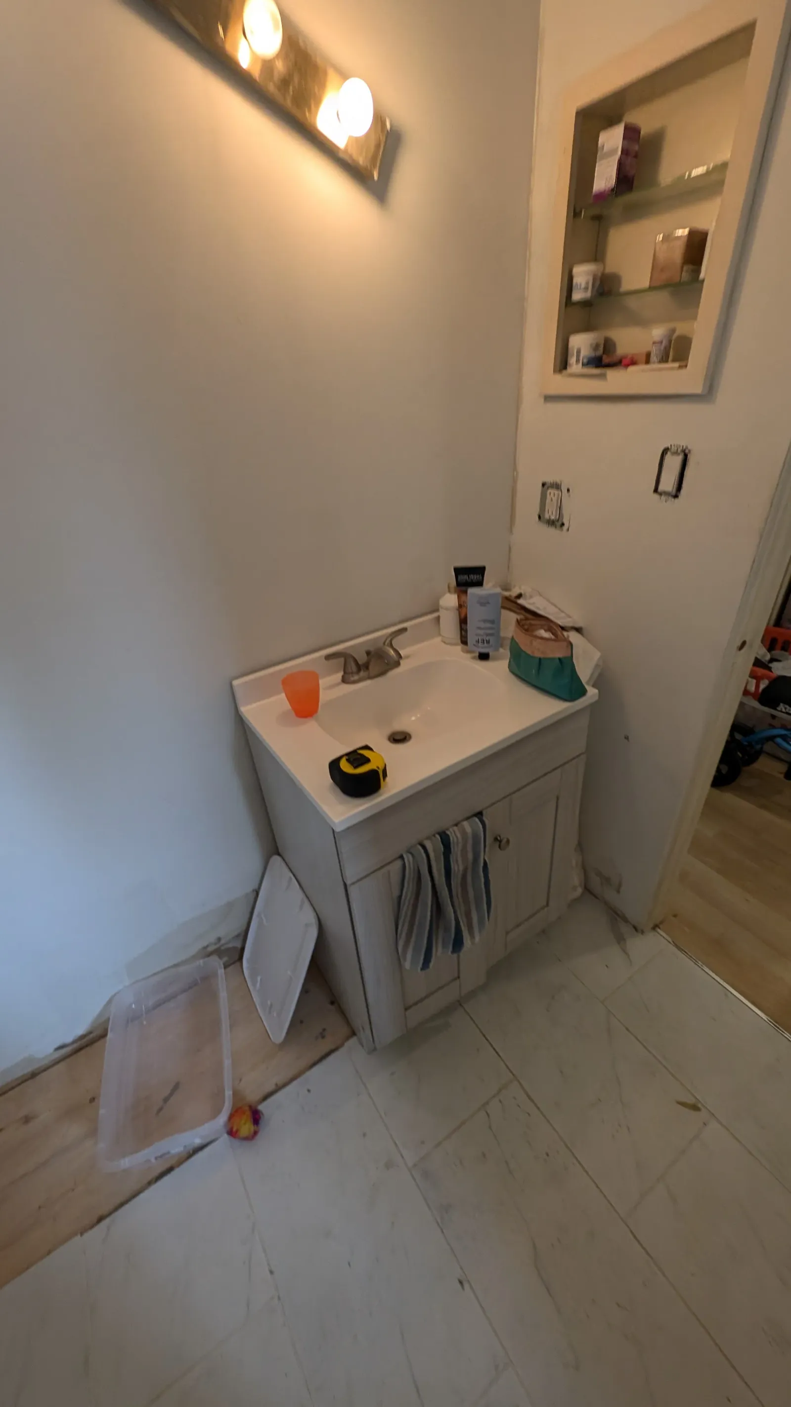 A unfinished Bathroom renovation in Calgary showing a incorrectly installed vanity