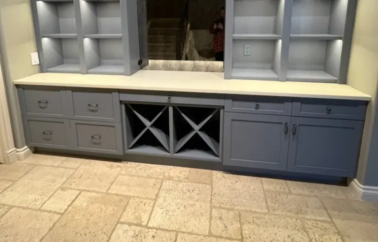Custom Dry bar with a quartz countertop in a basement renovation