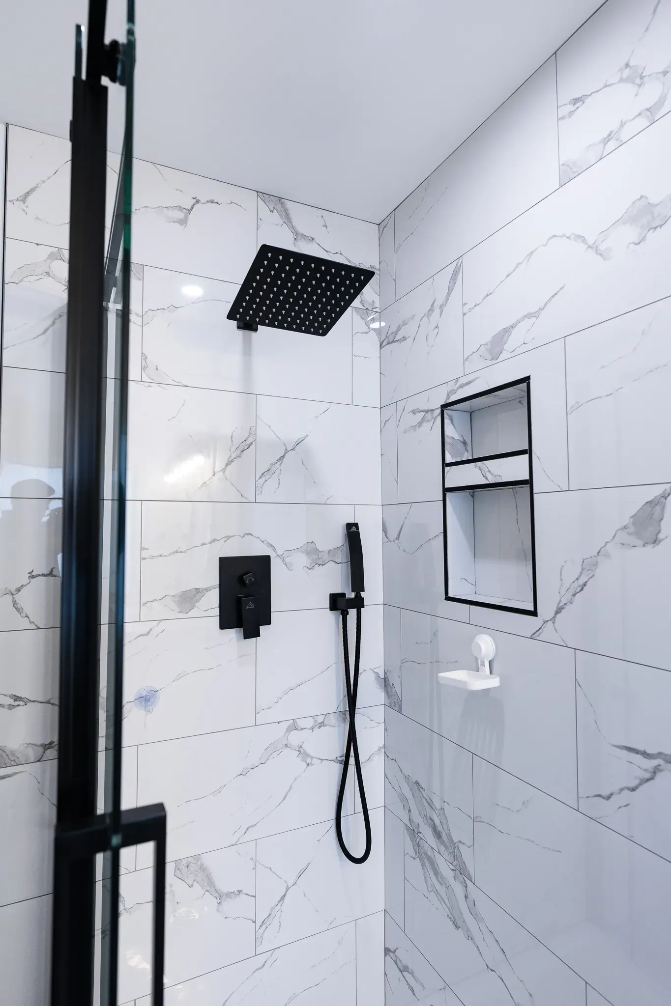 Sleek modern bathroom renovation in Calgary with matte black finishes