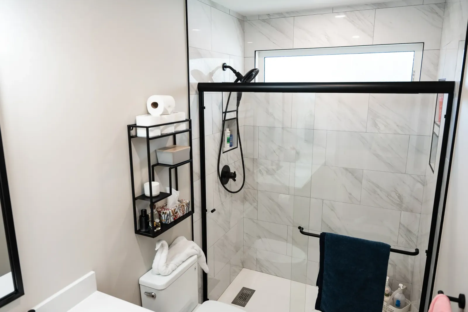 Large format marble effect tiles in a bathroom renovation in Calgary