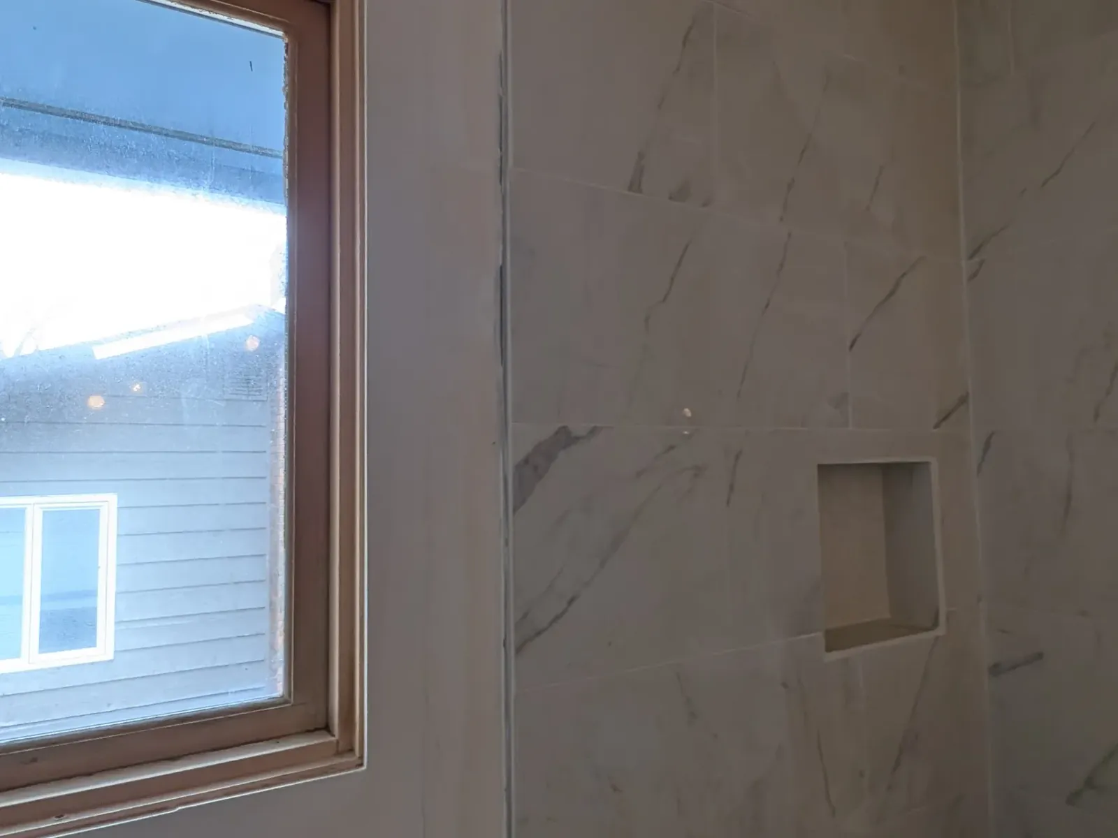 Incorrectly installed Shower tiles in bathroom renovation