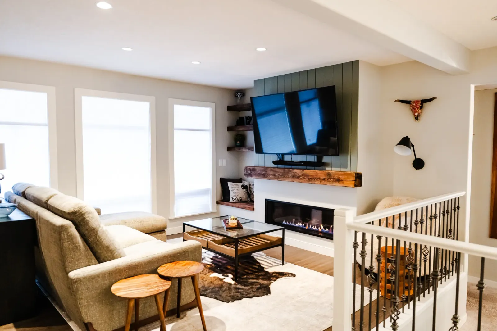 Custom reclaimed wood mantel and shelving for Calgary home renovation fireplace wall