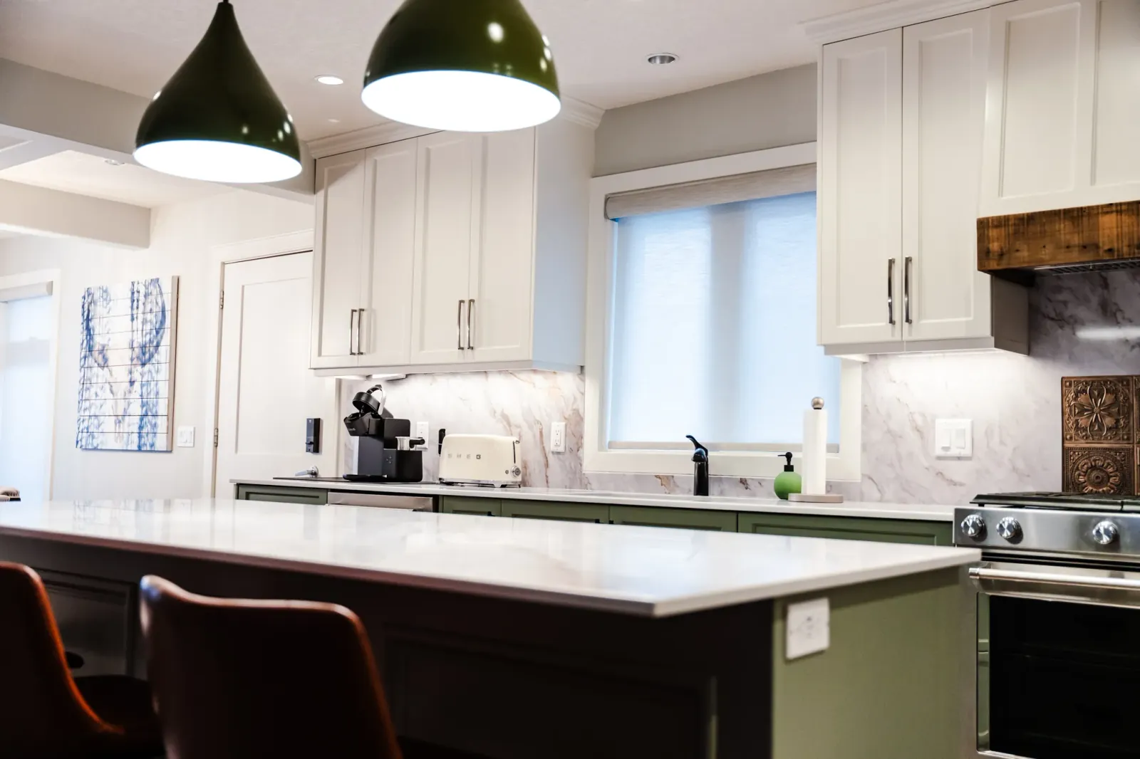 Completed modern kitchen renovation in Calgary with custom cabinetry and project-managed finish