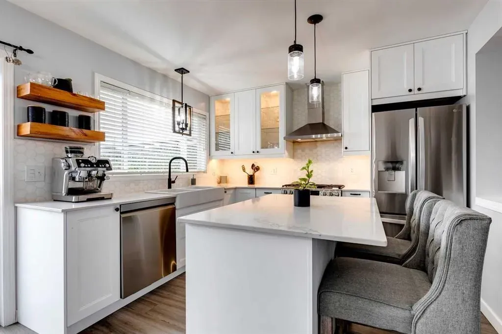 Luxurious Calgary kitchen reno with deluxe island chairs custom floating shelves and elegant pendants